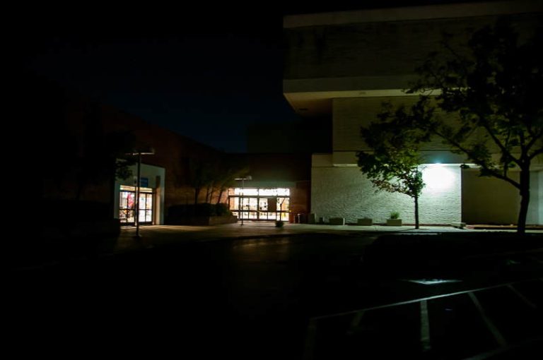 A portion of Sunrise Mall’s parking areas is dark after what mall general manager said was vandalism from homeless individuals attempting to tap into the mall’s electricity to charge devices. // M. Hazlip