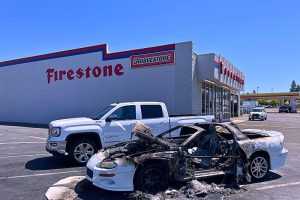 burned up Camero in front of Firestone