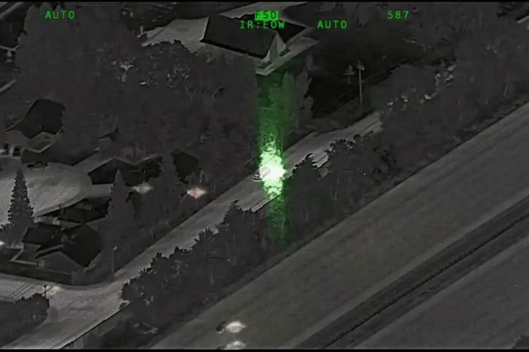 A suspect in a vehicle can be seen pointing a green laser at an aircraft in this still frame from a CHP video released Aug. 20.