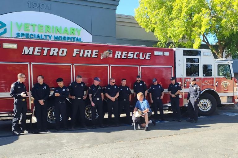 Crews from Metro Rescue 21 and Engine 23 reunited with a family and dog rescued during an Aug. 15 fire, on Sept. 9, 2024. // SB Williams