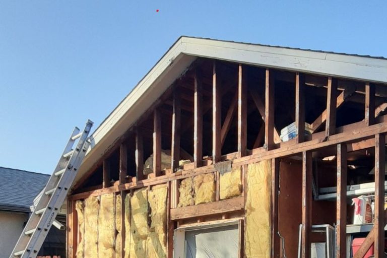 A home in the process of having its siding replaced.