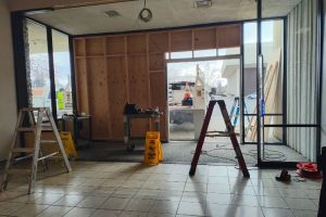 JC Penney doors were reframed with plywood following damage sustained from a truck that rammed through 2 entrances on Sunday. // SB Williams