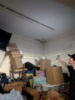 Water damage was visible on the ceiling in the corner of a storage area at Whatsupstairs, Sept. 10, 2025. // Sb Williams
