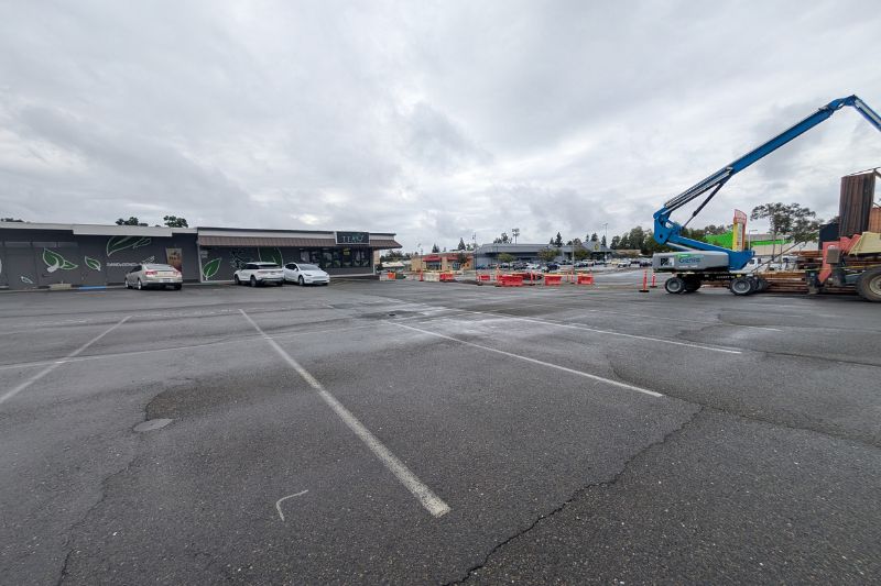 An empty parkin lot on Auburn Blvd. south of Wyte was proposed to be a future Starbucks. Construction equipment to the right is being utilized for the Auburn Bouleard Complete Streets project. // SB WIlliams